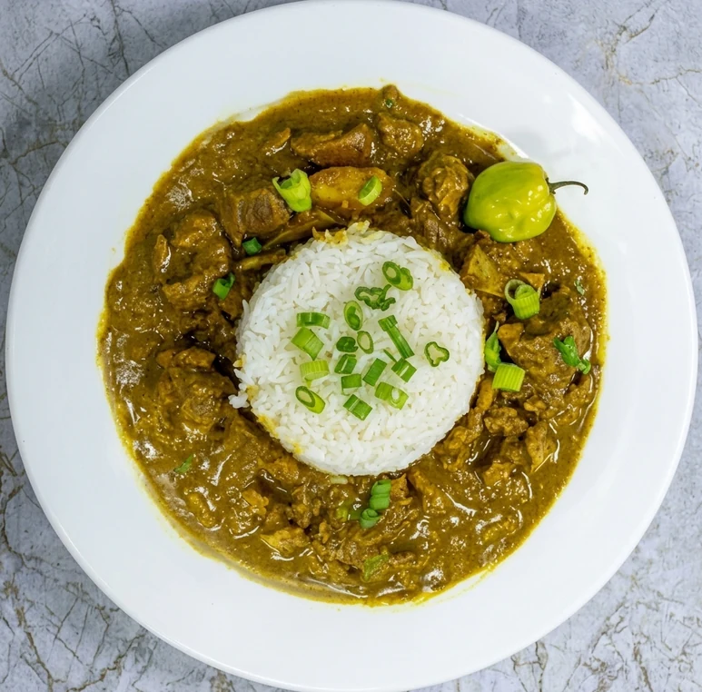 Jamaican curry goat with rice and peas at Twin Dem Kitchen London Ontario
